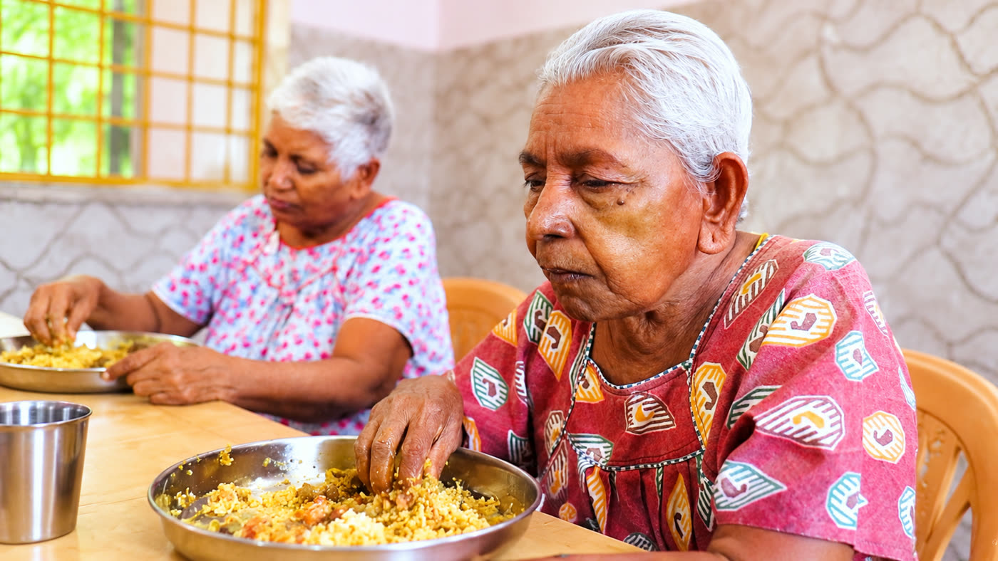 Elderly Mothers Sharing a Warm Meal